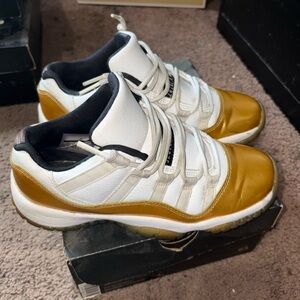 Jordan White and Gold low top 11s